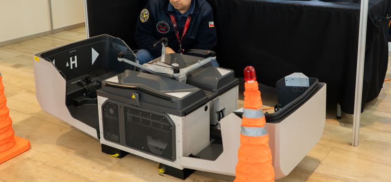 Automated drone docking station at an EXPODRON 2025 booth
